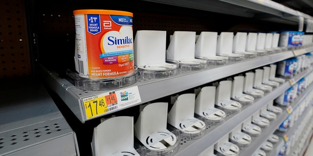 Shelves typically stocked with baby formula sit mostly empty at a store in San Antonio.