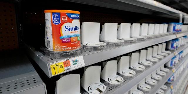 Shelves typically stocked with baby formula sit mostly empty at a store in San Antonio.