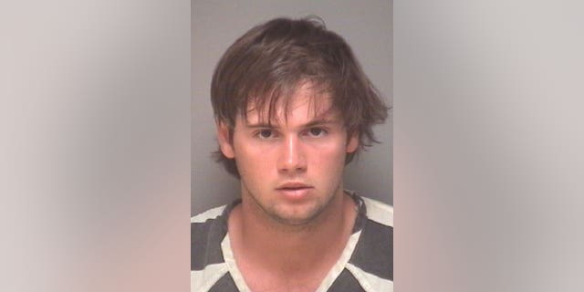 University of Virginia men's lacrosse player George Huguely is shown in a booking photo.