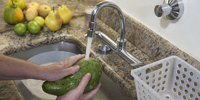 Fruits and vegetables should be rinsed well before eating, according to the FDA.