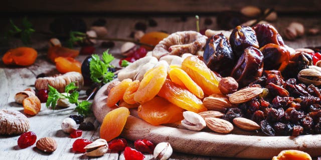 Apricots (left) are a yellow-orange fruit that's rich vitamins, fiber, and antioxidants. Dates (top right) are a sweet dark brown fruits that can boost energy and increase iron. Research has shown that both fruits raise prolactin levels in nursing mothers.