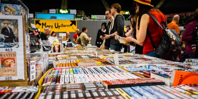 Sheffield, UK - June 12, 2016: Visitors browse a stall selling manga (comics) at the Yorkshire Cosplay Convention in Sheffield Arena