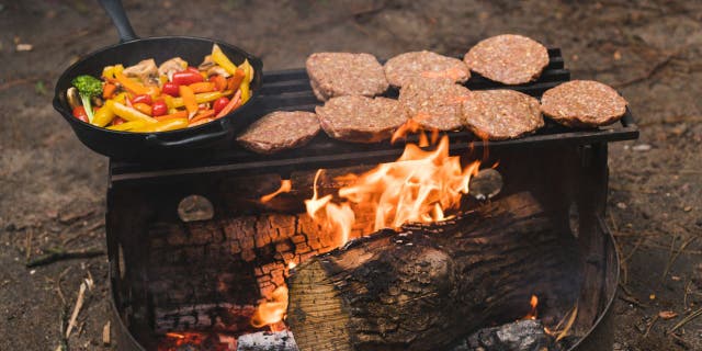 hamburgers on barbecue outside