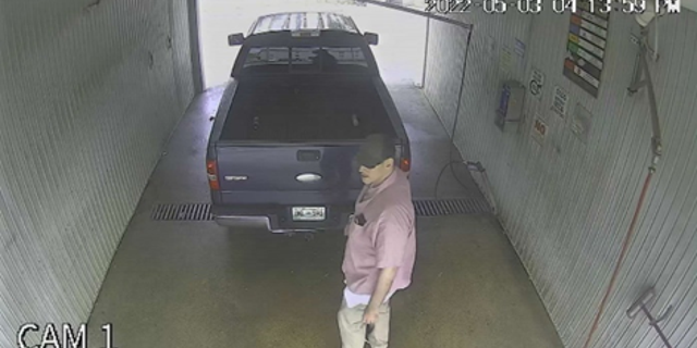 Photo provided by USMS on May 9, 2022, shows a man believed to be Casey White standing next to a 2006 Ford F-150 that had been abandoned at a car wash in the 2000 block of South Weinbach Avenue in Evansville, Indiana.