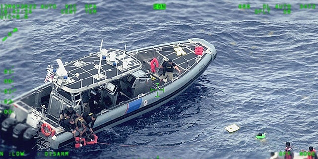 Rescue craft arrive on scene after a migrant vessel capsized north of Desecheo Island, Puerto Rico May 12, 2022 in a still image from surveillance aircraft video.  United States Coast Guard/Handout via REUTERS.  