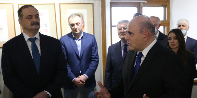 L-R: Governor of Dagestan Sergei Melikov, Russian billionaire, businessman and Council of the Federation Member Suleiman Kerimov and Prime Minister Mikhail Mishustin attend a presentation at the Naryn Kala Castle, on April 14, 2021, in Derbent, Dagestan, Russia. 