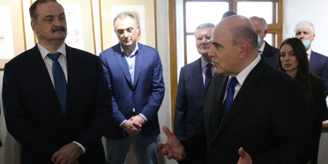 L-R: Governor of Dagestan Sergei Melikov, Russian billionaire, businessman and Council of the Federation Member Suleiman Kerimov and Prime Minister Mikhail Mishustin attend a presentation at the Naryn Kala Castle, on April 14, 2021, in Derbent, Dagestan, Russia.