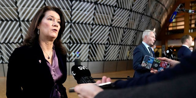 FILE - Sweden's Foreign Minister Ann Linde, left, and Finland's Foreign Minister Pekka Haavisto, right, speak with the media as the arrive for a meeting of EU foreign ministers at the European Council building in Brussels, Jan. 24, 2022. The question of whether to join NATO is coming to a head in Finland and Sweden, where Russia's invasion of Ukraine has shattered the long-held belief that remaining outside the military alliance was the best way to avoid trouble with their giant neighbor. (AP Photo/Virginia Mayo, File)