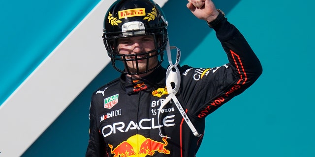 Verstappen and the other podium finishers were given football helmets to commemorate the track's location outside the Miami Dolphins' Hard Rock Stadium
