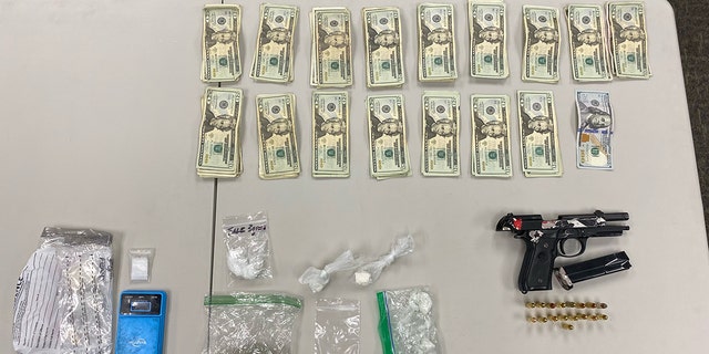 Officers seized cocaine laced with fentanyl, a gun and cash from the three suspects, authorities said.