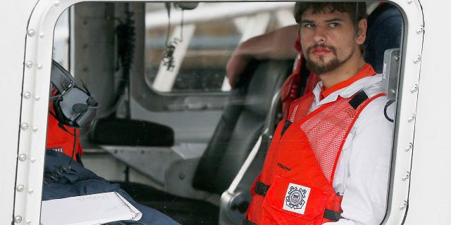 Nathan Carman arrives in a small boat at the U.S. Coast Guard station in Boston, Sept. 27, 2016.