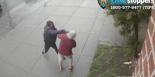 In this still image taken from surveillance video, the unknown suspect punches a 77-year-old man in the face.