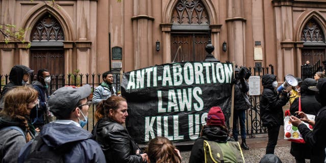 Abortion rights activists gather outside of a Catholic church in downtown Manhattan to voice their support for a woman's right to choose on May 7, 2022, in New York City.