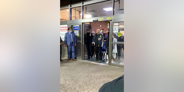 Officer Dennis Vargas greets officers after being released from Lincoln hospital on Tuesday.