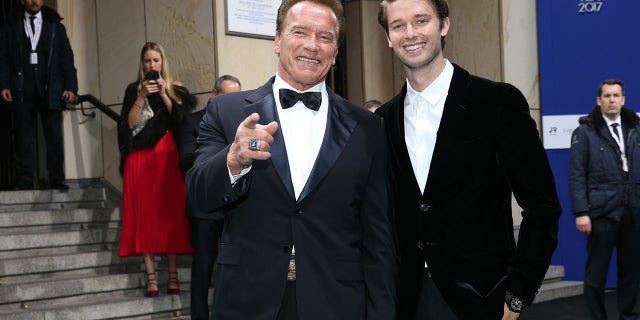 Arnold Schwarzenegger and son Patrick Schwarzenegger arrive for the GQ Men of the Year Awards in 2017.