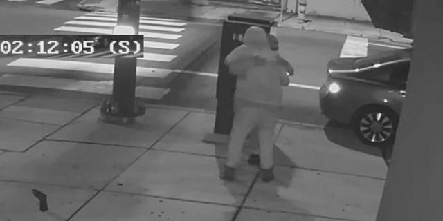 The suspect was seen on surveillance video hugging the victim just minutes before the fatal shooting on May 30, 2021.