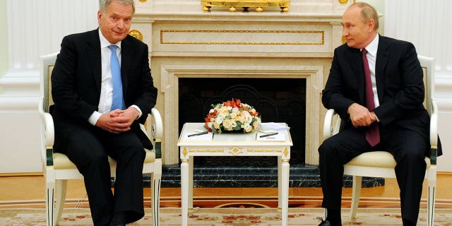 Russian President Vladimir Putin, right, and Finnish President Sauli Niinisto talk during their meeting in the Kremlin in Moscow, Russia, Oct. 29, 2021.