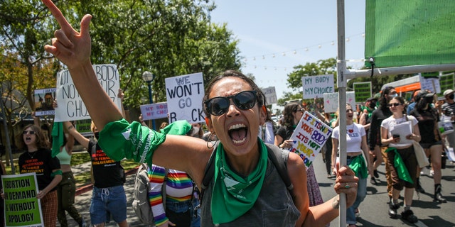 Micaela Bronstein, 34, and other abortion rights supporters and activists from Rise Up 4 Abortion Rights LA march on Santa Monica Boulevard on Saturday, May 7, 2022, in West Hollywood, California.