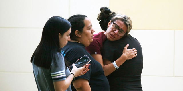 People react following a deadly school shooting in Uvalde, Texas (AP/Dario Lopez-Mills)