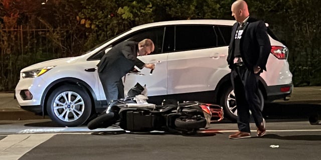 This image shows police investigating where Chinese food deliveryman Zhiwen Yan was fatally shot on 108 St. in Forest Hills, Queens, on April 30, 2022. 