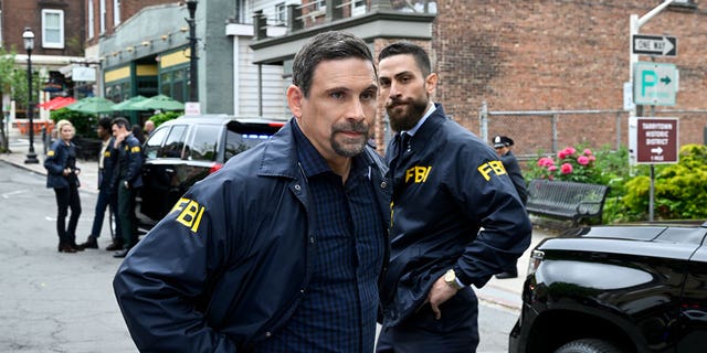 This image released by CBS shows Jeremy Sisto as Assistant Special Agent in Charge Jubal Valentine and Zeeko Zaki as Special Agent Omar Adom "O.A." Zidan in a scene from the series finale "FBI." CBS pulled the season finale after a deadly elementary school shooting in Texas. 