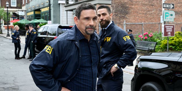 This image released by CBS shows Jeremy Sisto as Assistant Special Agent in Charge Jubal Valentine and Zeeko Zaki as Special Agent Omar Adom "O.A." Zidan in a scene from the series finale "FBI." CBS pulled the season finale after a deadly elementary school shooting in Texas.