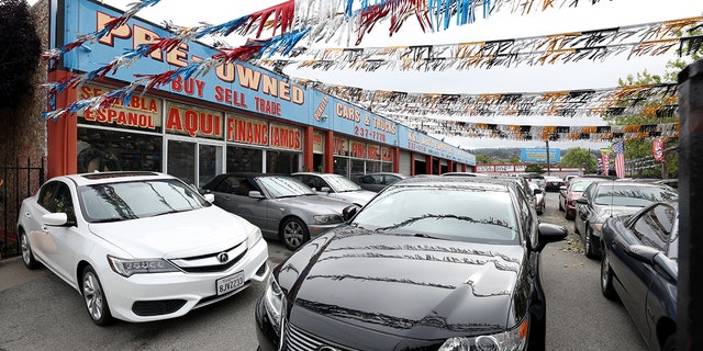 Used cars for sale are displayed on a lot. But in the state of Michigan (and a few other states), you can't sell cars on Sundays.