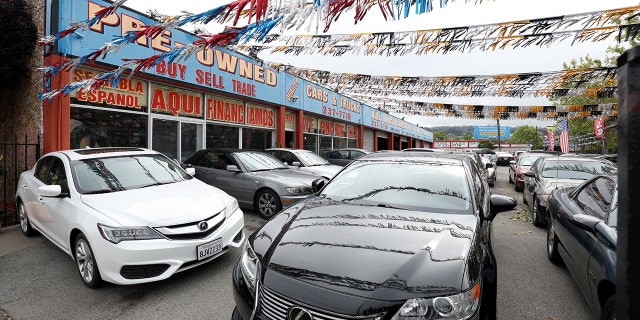 Used cars for sale are displayed on a lot. But in the state of Michigan (and a few other states), you can't sell cars on Sundays.