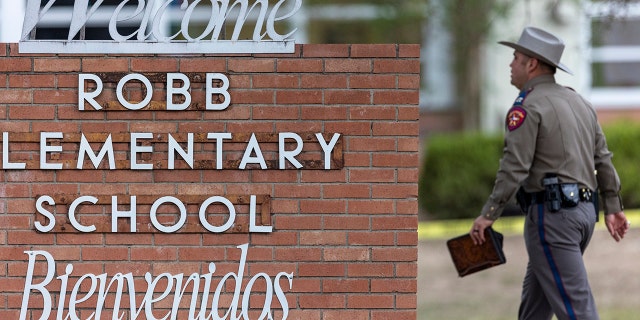 A state trooper walks past the Robb Elementary School sign in Uvalde, Texas, Tuesday, May 24, 2022, following a deadly shooting at the school.