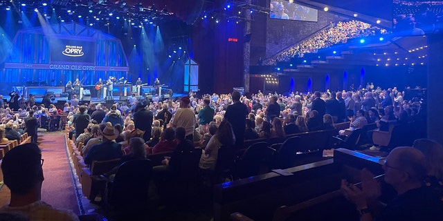 Military veterans and current service members stand to be honored by the crowd at the Grand Ole Opry's Salute the Troops event in Nashville, Tenn., on May 24, 2022. (Angelica Stabile/Fox News Digital)