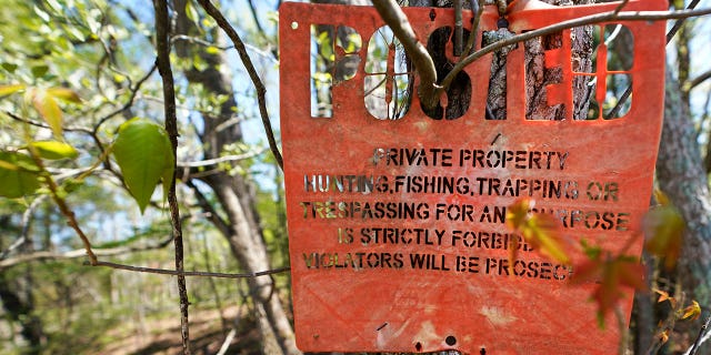 A No Trespassing sign on the 143-acre dairy and poultry farm of Jim Medeiros in Wilsons, Virginia, April 20, 2022.