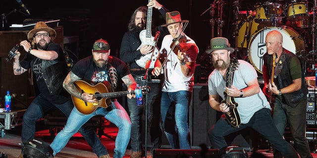 Hopkins, second from right, has been with the band since its start in 2002.