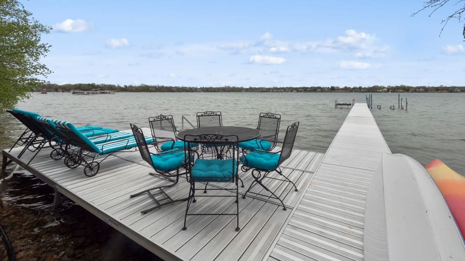 The Smurf House comes with a boat dock that sits on Michigan's Pine Lake.