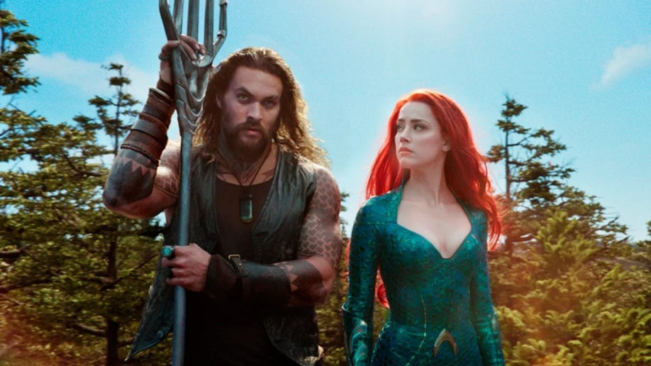 Amber Heard Jason Momoa aparecen en la película Aquaman