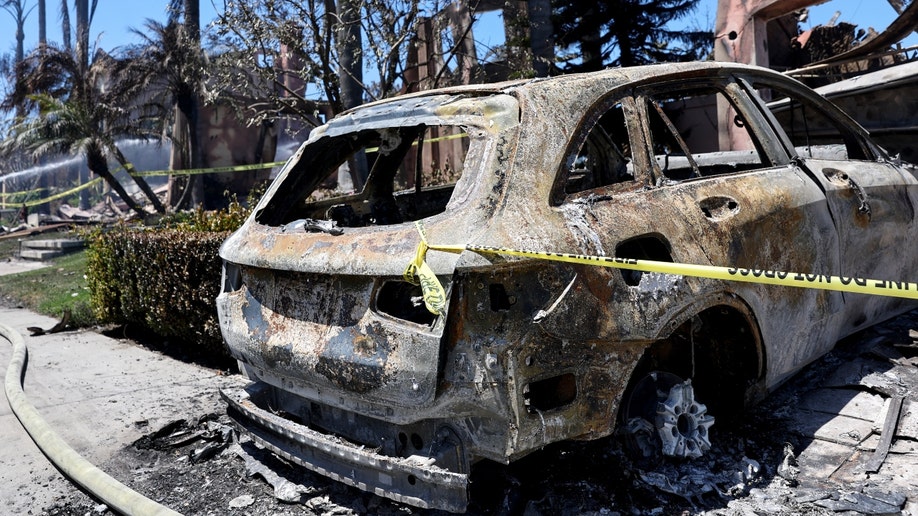 A car burned by California's Coastal Fire