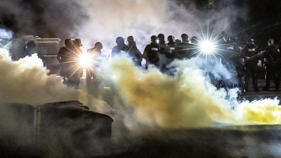 Brooklyn Center riot protest in Minneapolis Minnesota officers use tear gas