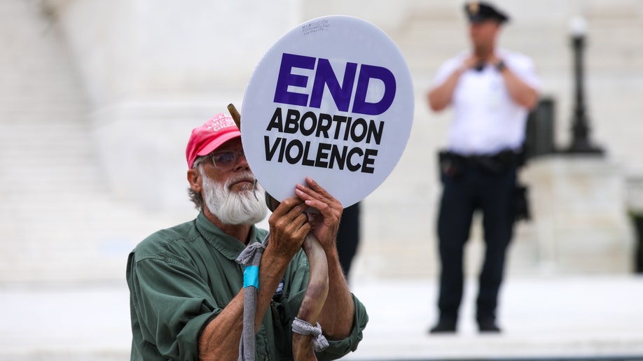 Activists rally outside the U.S. Supreme Court in Washington, D.C., on May 3.,2022., Tuesday after the leak of a draft majority opinion preparing for the court to overturn the landmark abortion decision in Roe v. Wade