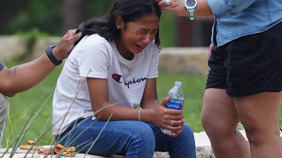 A girl cries following the Uvalde school shooting