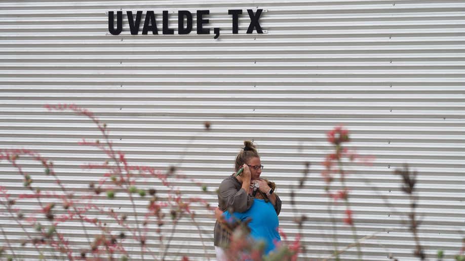A woman and girl hug after Uvalde Texas elementary school shooting