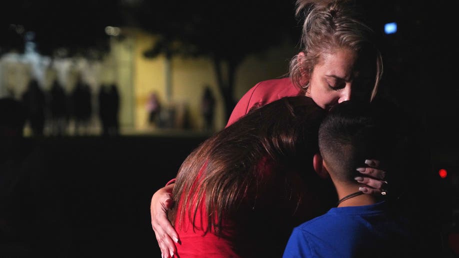 Family hugs after Uvalde Texas elementary school shooting
