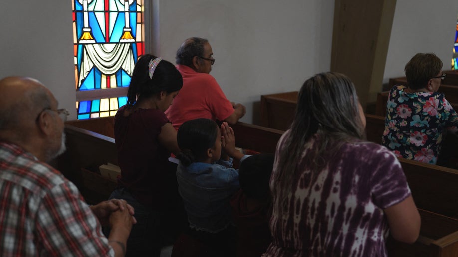 Woman grieves in church