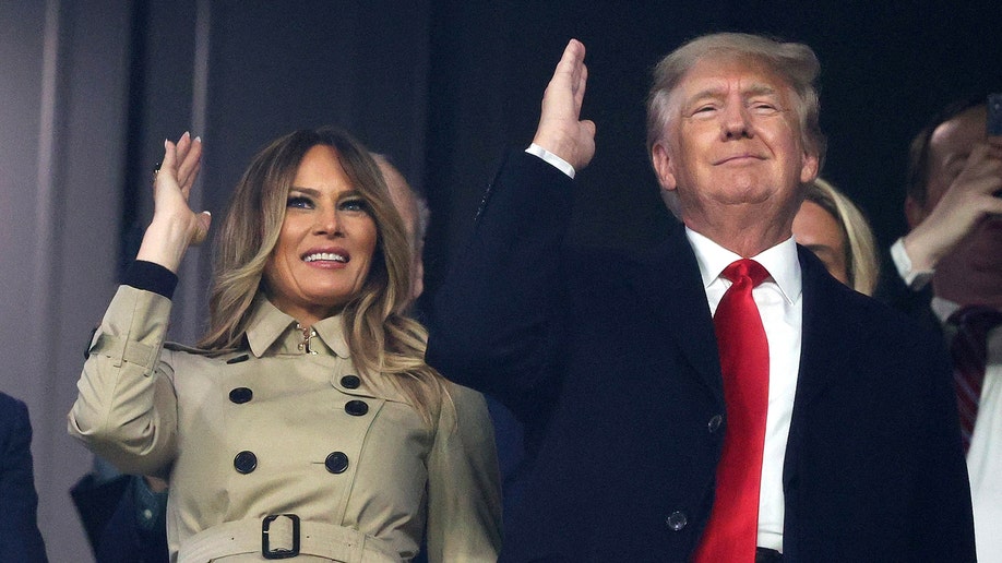 Former first lady and president of the United States Melania and Donald Trump do "the chop" prior to Game Four of the World Series between the Houston Astros and the Atlanta Braves Truist Park on October 30, 2021 in Atlanta, Georgia.