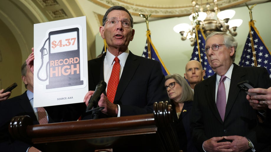 U.S. Sen. John Barrasso (R-WY) holds up a sign about gasoline prices as he speaks to members of the press as Sen. Joni Ernst (R-IA), Sen. Rick Scott (R-FL) and Senate Minority Leader Sen. Mitch McConnell (R-KY) listen after a weekly Senate Republican policy luncheon at the U.S. Capitol on May 10, 2022 in Washington, DC. Senate GOPs gathered for a weekly policy luncheon to discuss the Republican agenda.