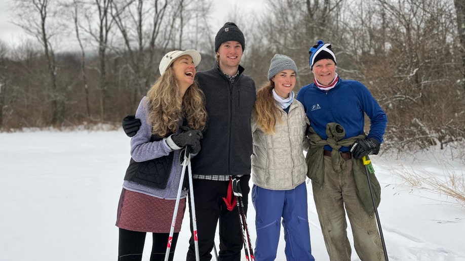 Moriah Wilson poses with her family in the snow