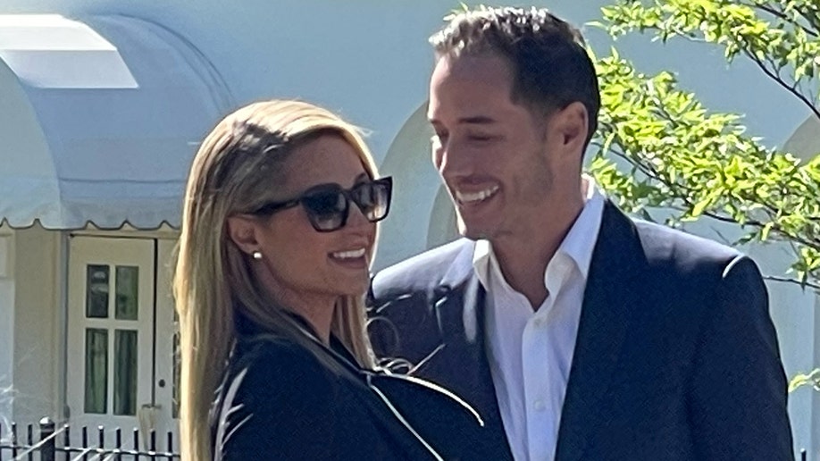 Paris Hilton and her husband Carter Reum arrive at the White House for a meeting on a child abuse law, Tuesday, May 10, 2022.