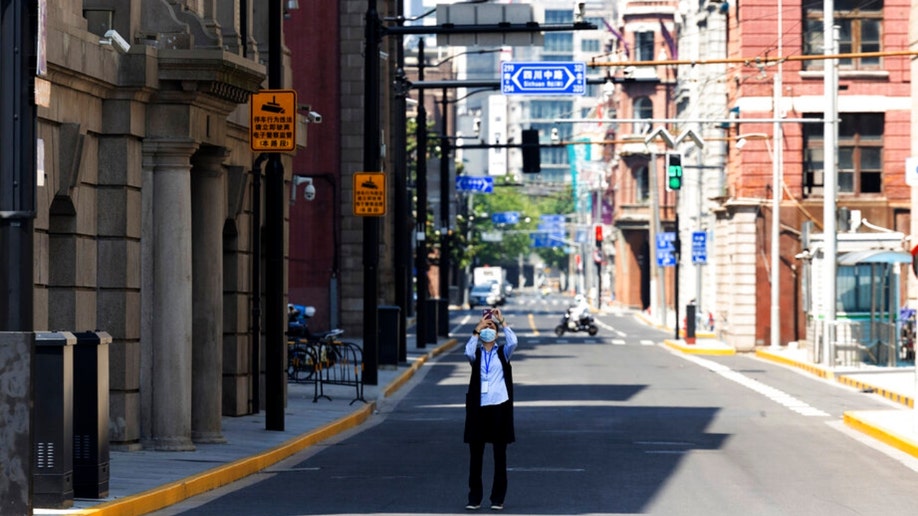 A resident walks on a Shanghai street