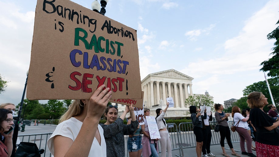 Demonstrators protest outside of the U.S. Supreme Court Wednesday, May 4, 2022 in Washington. (AP Photo/Alex Brandon)