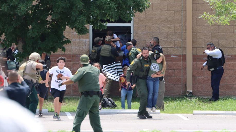 Children run to safety during a mass shooting Uvalde, Texas