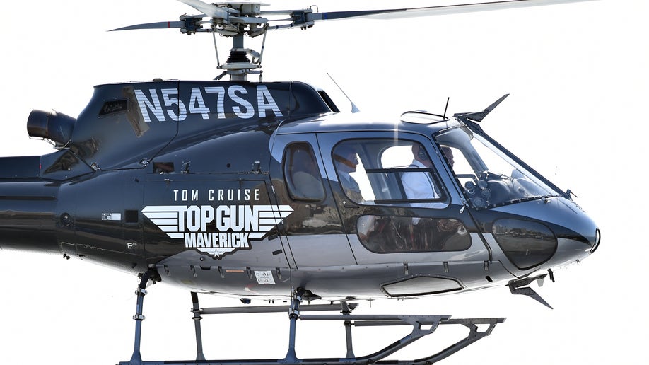 Tom Cruise arrives by helicopter 