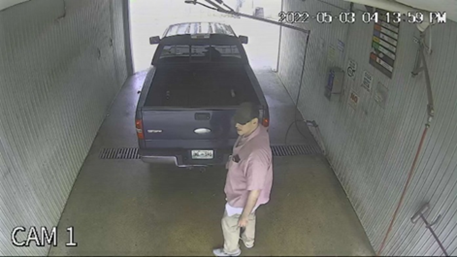 Photo provided by USMS on May 9, 2022, shows a man standing next to a 2006 Ford F-150 had been abandoned at a car wash in the 2000 block of South Weinbach Avenue in Evansville.